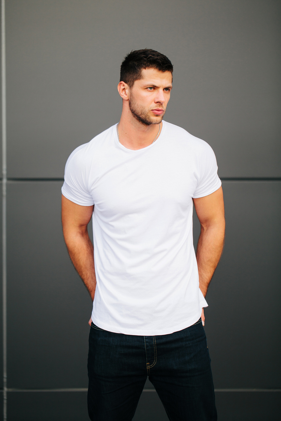 Man Wearing White Blank T-Shirt with Space for Your Logo